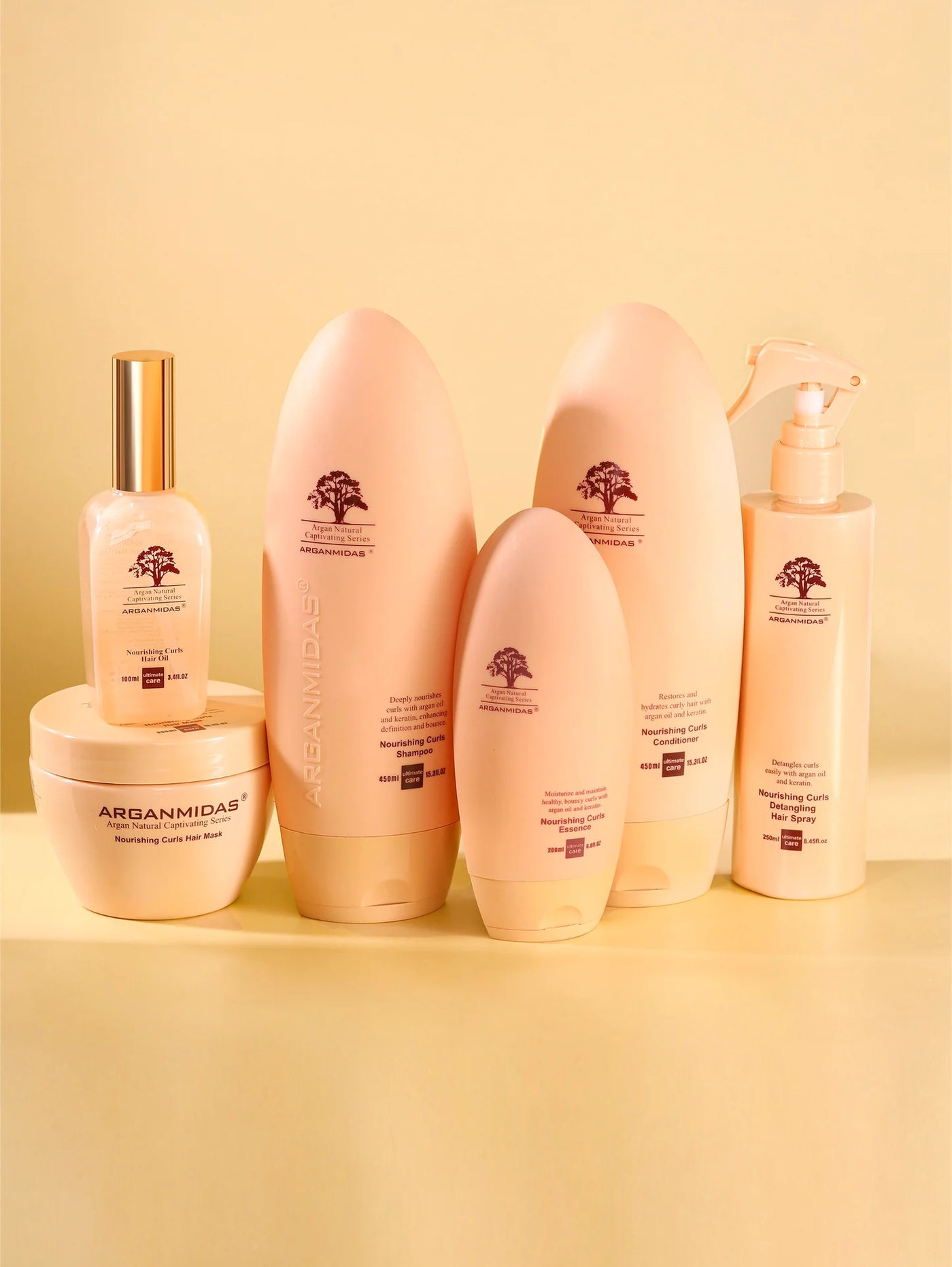 Set of Arganicare hair care products on a yellow background
