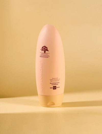 Pink bottle with a brand logo on a yellow background