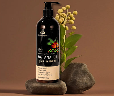 Black shampoo bottle with 'Solaris Pure' branding on a brown background with rocks and plants.